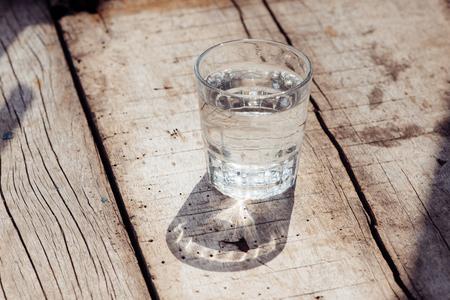 glass of water on wood backgroundの写真素材
