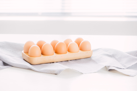 Farm raw fresh egg in pack on gray table ingredient for breakfast preparation scrambled eggs omelet fried eggの写真素材