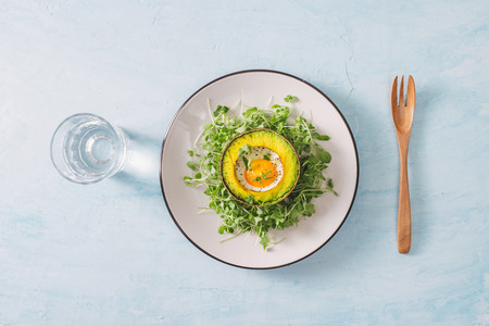 Breakfast/Brunch : Baked eggs in avocado.の写真素材