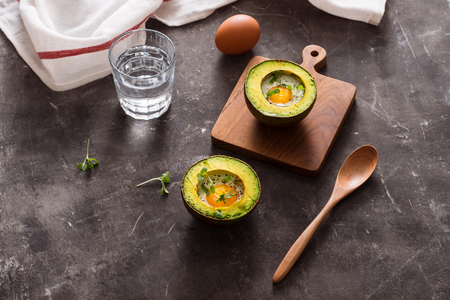 Homemade Organic Egg Baked in Avocado with Salt and Pepperの写真素材