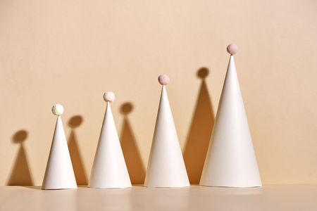 Creative Christmas tree made of paper on beige backgroundの写真素材