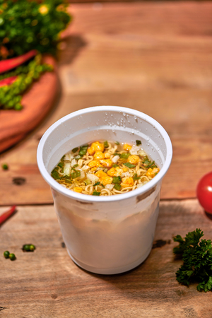 instant noodle, asian fast food, noodle cup on wooden background.の写真素材