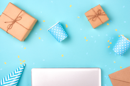 Gift box and birthday party things on a blue backgroundの写真素材