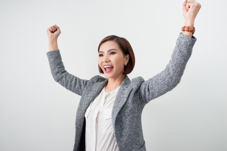 Asian beautiful girl feel happy. smiling woman show hand up successful sign actionの写真素材