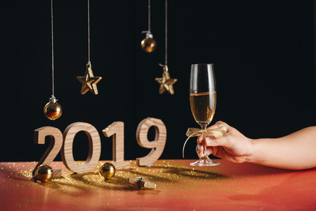 Sparkling New Year background, copy space. Champagne with decorations on New Years Day