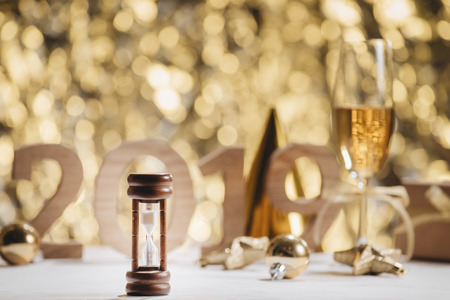 New Years Eve celebration background with pair of flutes, bottle of champagne