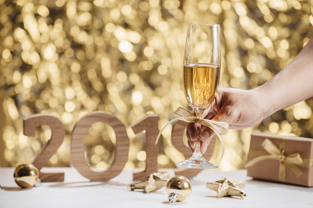 New Years Eve celebration background with pair of flutes, bottle of champagneの写真素材