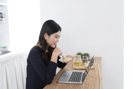 Young woman working at home in the morningの写真素材