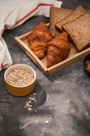 Breakfast with toast and croissant. milk in a glass bottle. Good start to the day. Good morningの写真素材