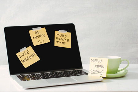 colored paper stickers with business strategy and laptop on tabletop