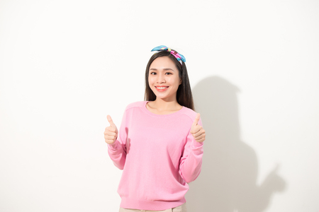 People person facial expression concept. Close up photo portrait of pretty funny funky charming cute nice glad girl making giving double two thumb up sign isolated on white backgroundの写真素材
