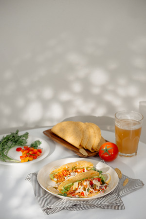 Authentic mexican tacos with beer. Mexican tacos with ground meat, beef, beans, onions and salsaの写真素材