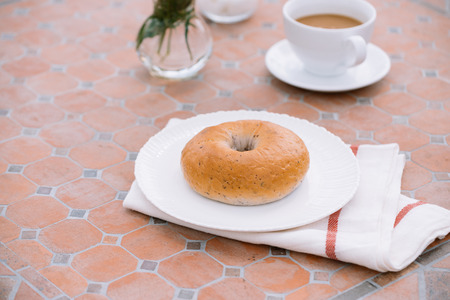cup of coffee with bread on table in the morning with sunlight, breakfastの写真素材