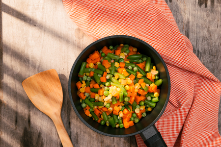 Pan with frozen vegetable mix for frying. Studio Photoの写真素材