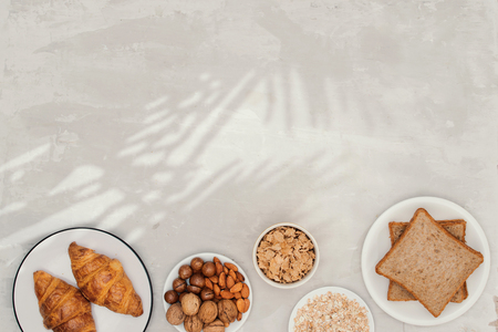 continental breakfast - toast, croissants, mix nuts, milkの写真素材
