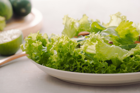 Mix of green fruits and vegetables on rustic wooden backgroundの写真素材