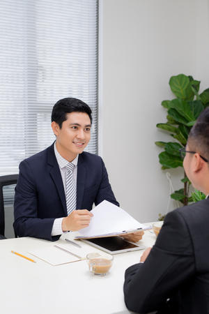 Job interview of two business professionals. Greeting new colleagueの写真素材