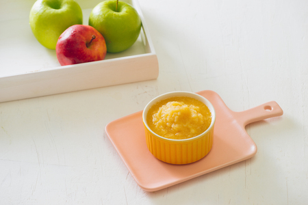 Homemade healthy baby food. Bowl of apple baby puree.の写真素材