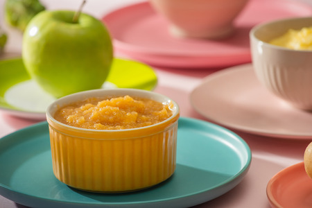 Natural baby food concept. Bowl of apple baby puree.の写真素材