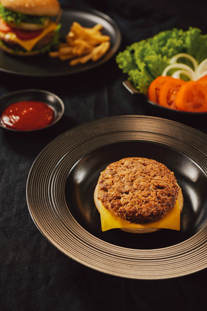 Fresh Tasty burger on dish with with french fries, ketchupの写真素材