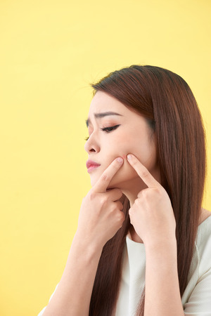 woman who checks her skin. acne treatmentの写真素材