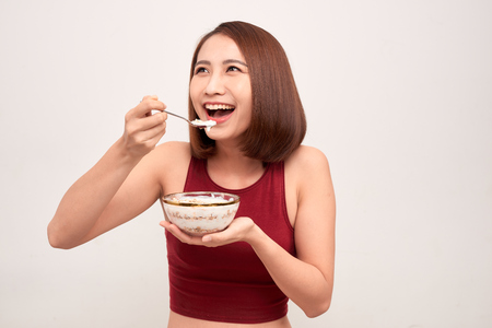 Woman in gym eating healthy after exerciseの写真素材