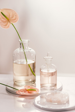 Bottles with different perfume oils on tableの写真素材