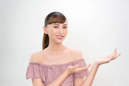pretty girl with light make-up showing her palmの写真素材