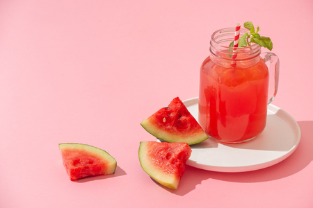 Watermelin jiuce on the pink backgroundの写真素材