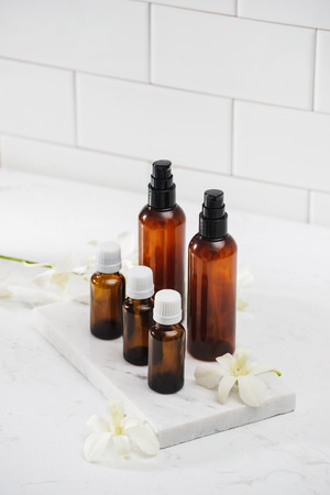 Different cosmetic bottles isolated on whiteの写真素材