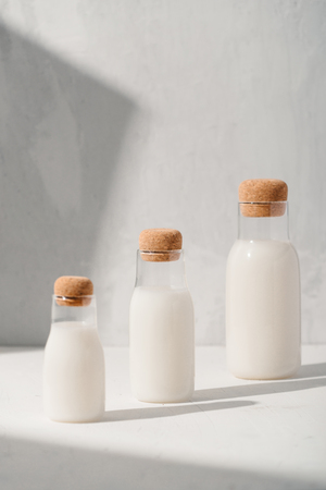 Milk or cocktail creative concept, minimalism styled, angle view, space for a text.の写真素材