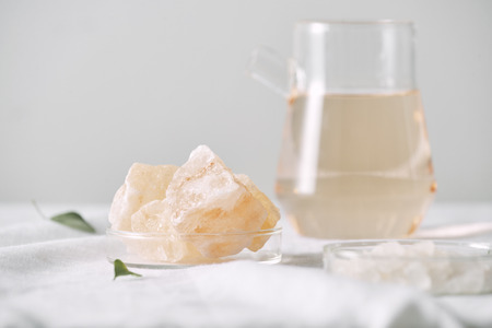 Aromatherapy. Small glass bottles with cosmetic oils. Bath salt. Fresh leaf. Objects for spa...