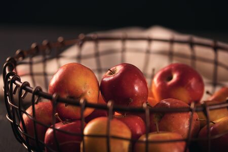 Bright tasty red apples in a basket, close-upの写真素材