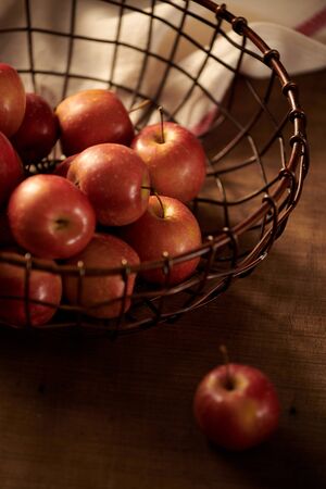 Red apples on a wooden backgroundの写真素材