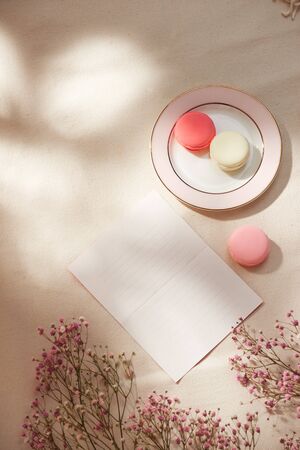 Spring morning concept. Flat-lay of flowers and card over background, top view with space for your textの写真素材