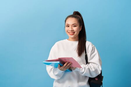College Student girl. Isolated portrait of a beautiful young asian woman student.の写真素材