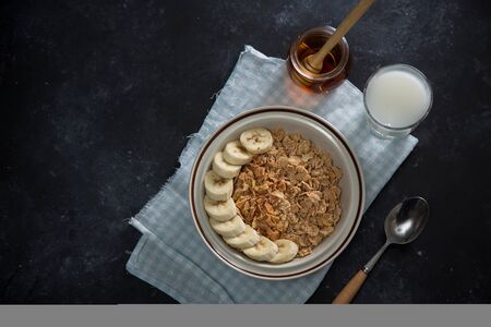 Tasty and healthy breakfast: fruits, corn flakes, milk and honey.の写真素材