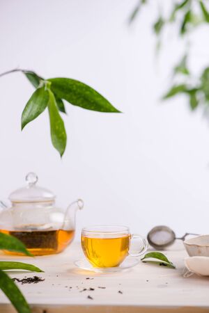 Dried tea leaves with tea potの写真素材