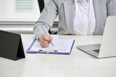Young, attractive and confident business woman working in officeの写真素材