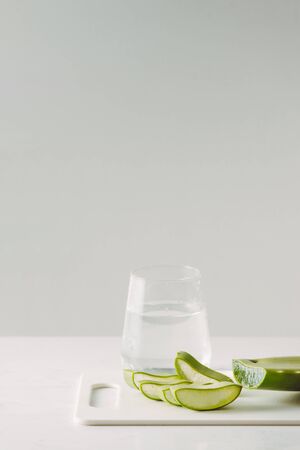 Fresh aloe vera leaves and glass of aloe vera juice healthy drink isolated on white backgroundの写真素材