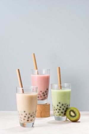 Various Bubble Tea glasses with drink straws isolated on white background.の写真素材