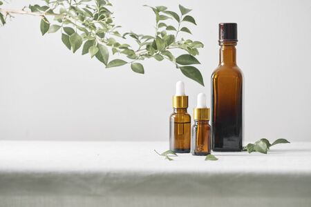 Bottles with aroma oil, medicines on wooden background. Selective focus,horizontal.の写真素材