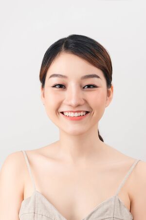 Close up of young Asian beautiful woman with smiley face.の写真素材