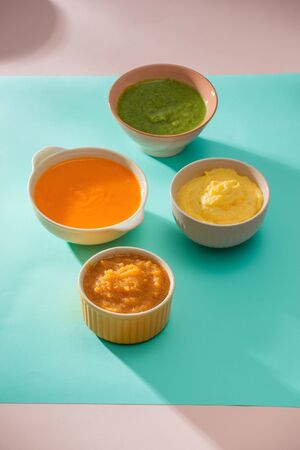 Homemade vegetable baby food purees in glass jarsの写真素材