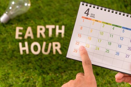 Letter happy earth day concept on green grassの写真素材