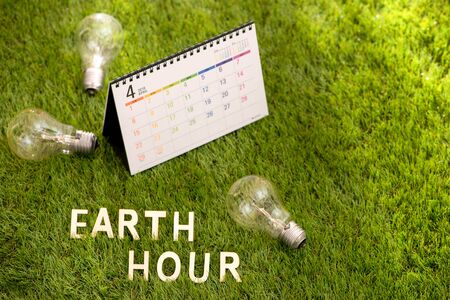 Letter happy earth day concept on green grassの写真素材