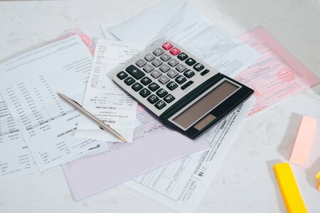 Calculate, analyze report results on office desk.の写真素材