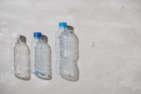 close up of used plastic bottles on white background の写真素材