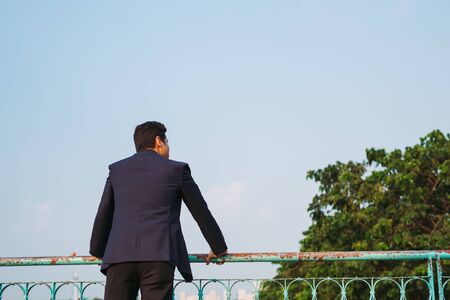 rear view of an asian businessman.の写真素材