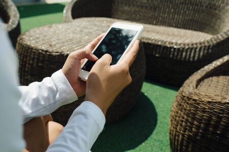 Women holding smartphone with black screenの写真素材